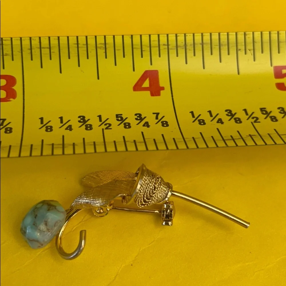 Antique gold brooch with turquoise